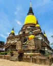June 2011 Ayutthaya, Thailand - Buddhist temple with yellow cloth adorning the staues.