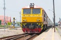 State Railway of Thailand Diesel electric locomotive 4226 hauls a train in Ayutthaya Railway station, Ayutthaya, Thailand