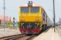 State Railway of Thailand Diesel electric locomotive 4226 hauls a train in Ayutthaya Railway station, Ayutthaya, Thailand
