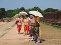 A group of Thai women wear traditional costumes