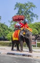 tourists ride on an elephant in the Historical Park in Ayutthaya