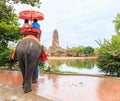 AYUTTHAYA, THAILAND - JULY 25: Tourists on an elephant ride tour Royalty Free Stock Photo