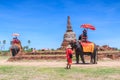 AYUTTHAYA, THAILAND-JUNE 1: Tourists on an elephant ride tour