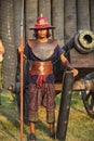 AYUTTHAYA,THAILAND - MARCH 17,2013 : Ancient Siamese warrior with shield and spear on the background of the fortress wall