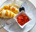 ayvar, roll, cheese, olives served in a plate