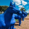 Bright blue Xian terracotta army pieces decorating a park at Bacalhoa vineyards in Azeitao, Portugal