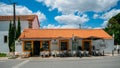 Shopfront selling local products such as cake, cheese and wine built in traditional Portuguese architecture in the