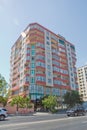 Facade of modern multi-storey new residential orange building near BAku . New apartment house . Storey houses modern Royalty Free Stock Photo