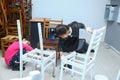 Kids Old chairs are painted white . Painting Old Furniture . Baby chairs are painted. Upcycling concept. Azerbaijan Baku . 17.05. Royalty Free Stock Photo