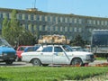 Azerbaijan, Baku - May 01, 2007: Classic soviet vintage sedan car VOLGA GAZ with trunk that is overload by boxes with