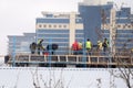 Workers place rails on the building . Authentic construction worker busy on the positioning of formwork frames in Royalty Free Stock Photo