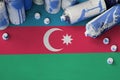 Azerbaijan flag and few used aerosol spray cans for graffiti painting. Street art culture concept