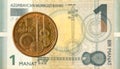 1 azerbaijani qepik coin against 1 azerbaijani manat bank note Royalty Free Stock Photo