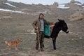 Azerbaijani shepherd next to donkey with dog Royalty Free Stock Photo