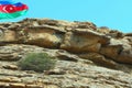 Azerbaijanian Flag on rocky Mountain Landscape