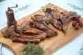 Azeri national antrikot kebab on a wooden board . Dry Satureja . Dried savory spice Satureja hortensis . Copper pepper dish .