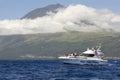 Azores coastline landscape in Pico island with whale watching bo