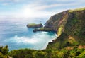 Azores - Flrores island - View from Miradouro do Ilheu Furado towards the Atlantic ocean and the sea cliffs with sun and blue sky