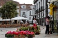 A woman buying flowers in a market place