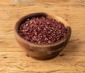 Azuki beans in a bowl over wooden table Royalty Free Stock Photo