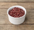 Azuki beans in a bowl over wooden table Royalty Free Stock Photo