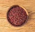 Azuki beans in a bowl over wooden table Royalty Free Stock Photo