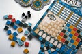 Azul components of board game on white background. Gameful plates and fields during gameplay. Leisure, family and friends time Royalty Free Stock Photo