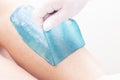 Azulene depilation. wax hair removal, shugaring. concept of smooth skin without hair. azulene of green color. removal