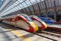 Azuma high speed trains of London North Eastern Railway LNER and Lumo of FirstGroup at King\'s Cross train station in London Royalty Free Stock Photo