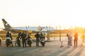 Azur airlines aircraft take off at Boryspil international airport. a group of unrecognizable people greets an airplane while