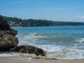 Azure beach with clear water of Indian ocean at sunny day A view of a cliff in Bali, Indonesia Royalty Free Stock Photo