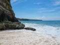 Azure beach with clear water of Indian ocean at sunny day A view of a cliff in Bali, Indonesia Royalty Free Stock Photo