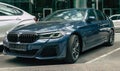 Azure Blue BMW M5 F90 Facelift standing at business center parking