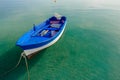 Azure blue motor boat floating on calm transparent sea water on Greek Kos island Royalty Free Stock Photo