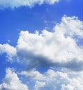 Azure-blue summer sky with bright white floating clouds