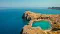 Azure heart shaped sea bay in Lindos, Rhodes, Greece Royalty Free Stock Photo