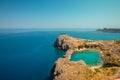 Azure heart shaped sea bay in Lindos, Rhodes, Greece Royalty Free Stock Photo