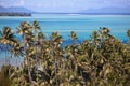 Azure lagoon of island BoraBora, Polynesia. Mountains, the sea, palm trees.