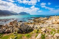 The azure water, boulders and algae