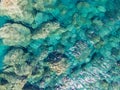 Azure water texture, transparent sea surface with a rocky bottom. Aerial view, Chora, agian Anna, Amorgos, natural blue background Royalty Free Stock Photo