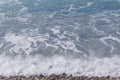 Azure waves on beach in Nice at summer