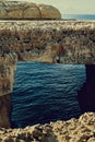The Azure Window in Gozo island - Mediterranean nature wonder in beautiful Malta - Unrecognizable touristic scuba divers Royalty Free Stock Photo