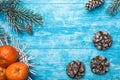 Azure wood background. Green fir tree. Cookies. Fruit with mandarin. Christmas greeting card and new year. Royalty Free Stock Photo