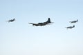 B-17 and three P-51's fly in formation