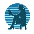 silhouette of a female teen reading a book.