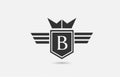 B alphabet letter logo icon for company in black and white. Creative badge design with king crown wings and shield for business