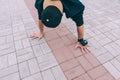 B-boy Break Dancer stands on his hands upside down with an action camera Royalty Free Stock Photo