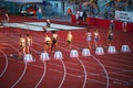 Athletes in Action: Women Begin 100m Sprint from Starting Blocks in Track and Field Royalty Free Stock Photo