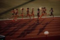 B. BYSTRICA, SLOVAKIA, JULY 20, 2023: Women Runners Strive in 800m Race Bathed in Serene Sunset Ambiance on Track and Field