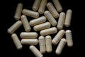 B-complex pills on a dark background, biologically active supplements